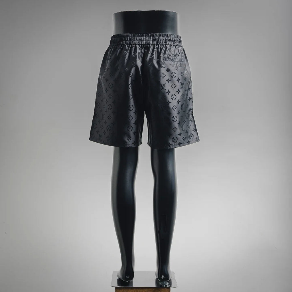 Louis Vuitton monogram shorts, back view with elastic waistband and black allover pattern