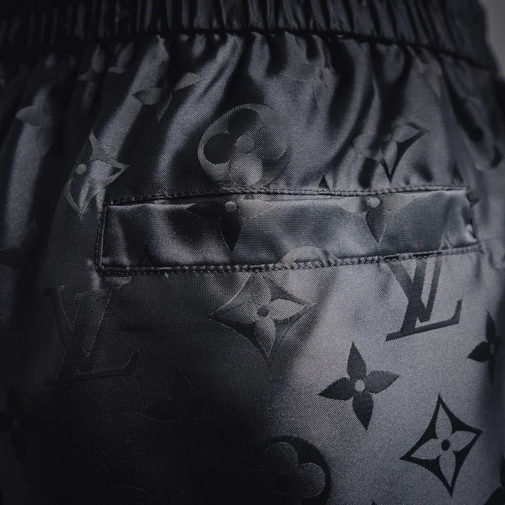 Louis Vuitton monogram shorts with front pocket and dark patterned fabric