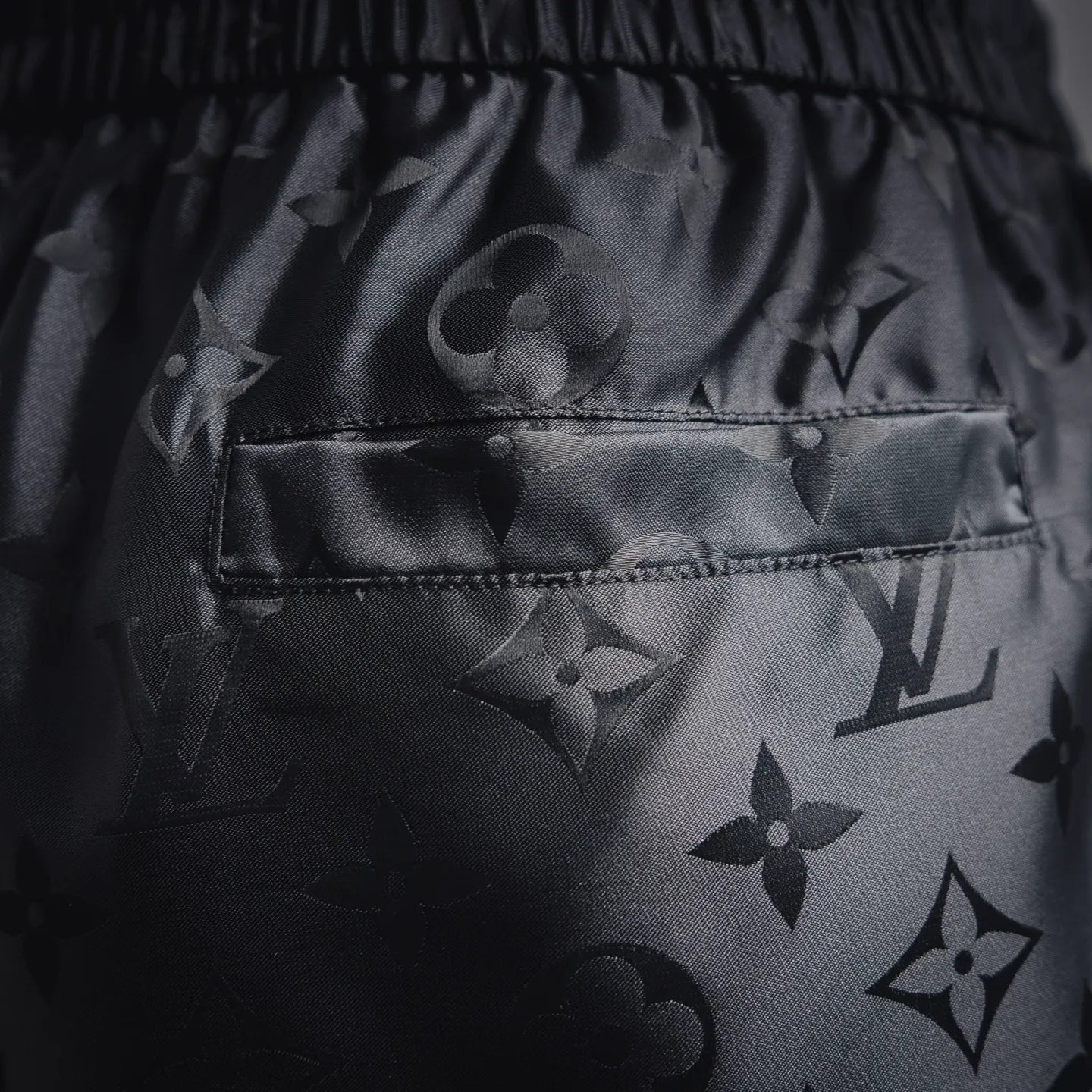 Louis Vuitton monogram shorts with front pocket and dark patterned fabric