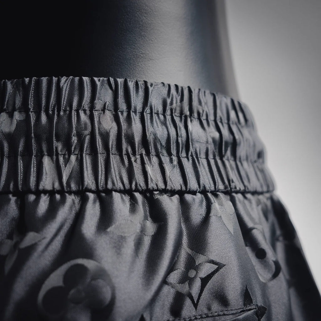 Louis Vuitton monogram shorts waistband and upper leg, black textured fabric