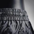 Louis Vuitton monogram shorts waistband and upper leg, black textured fabric