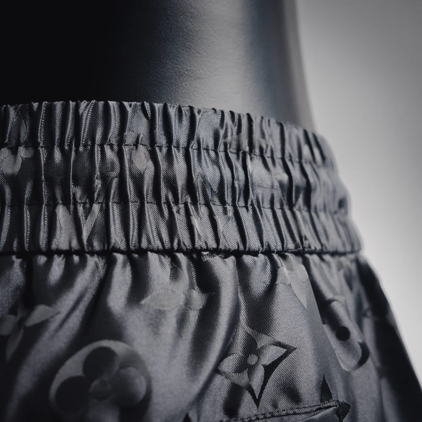 Louis Vuitton monogram shorts waistband and upper leg, black textured fabric