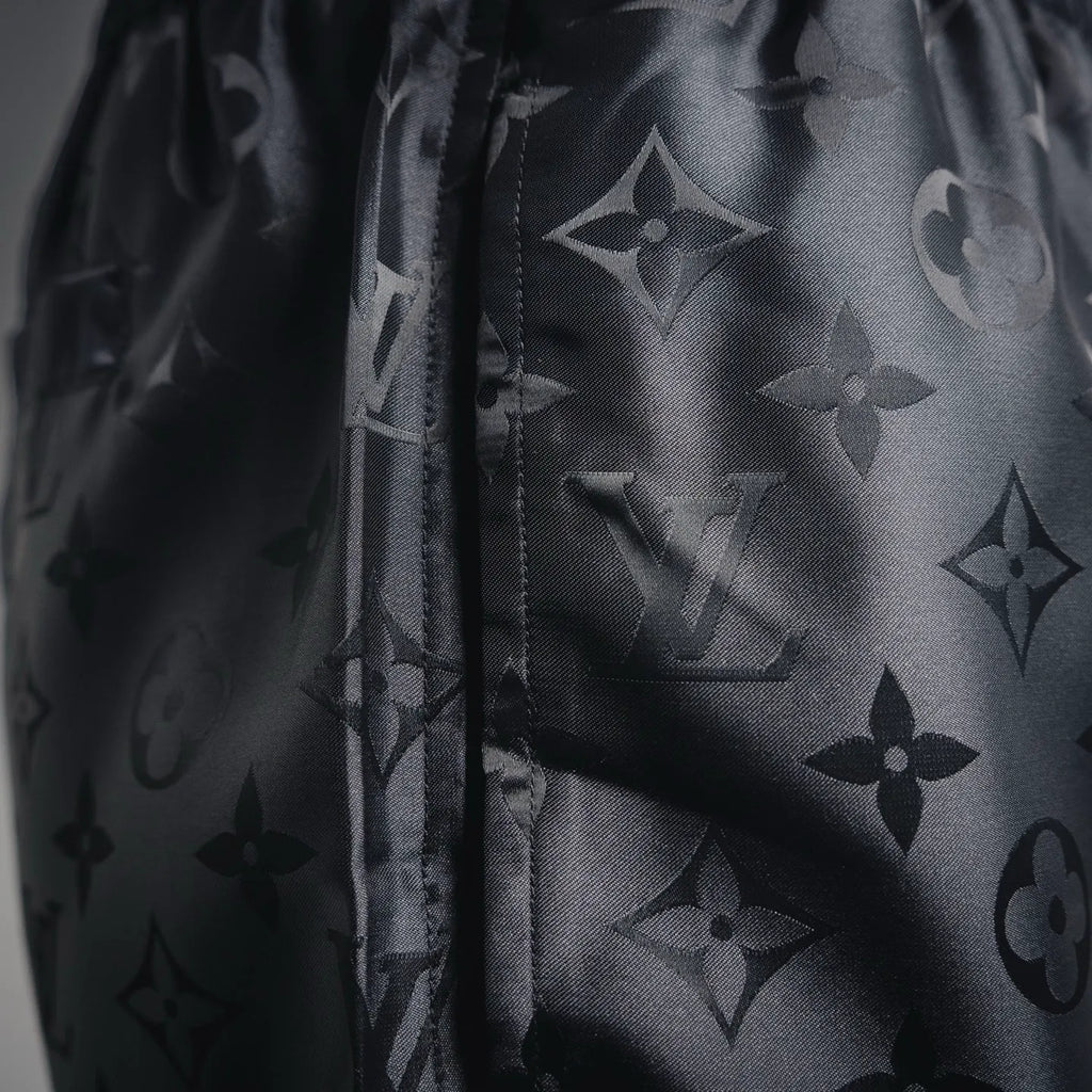 Louis Vuitton monogram shorts side seam detail with dark allover pattern
