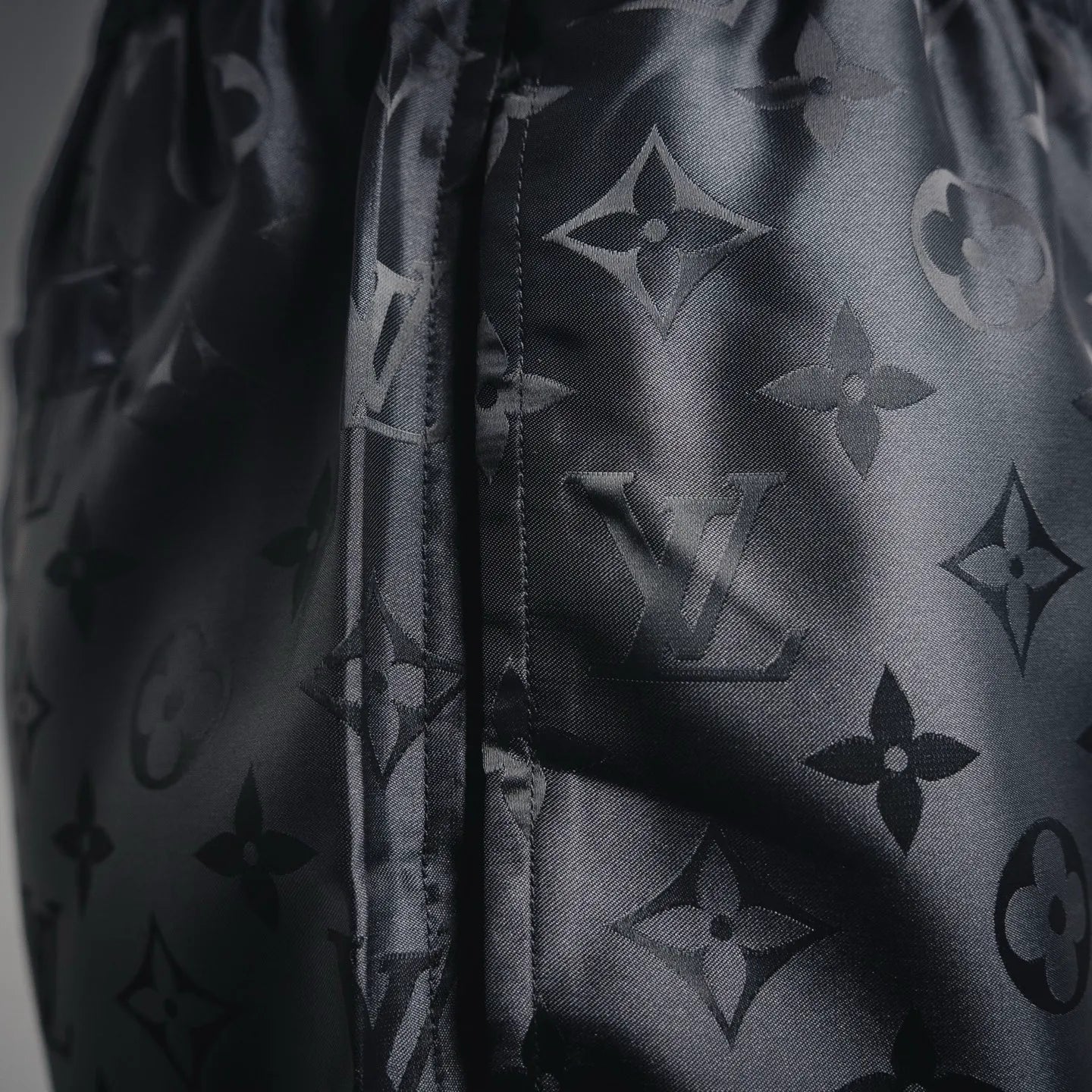Louis Vuitton monogram shorts side seam detail with dark allover pattern