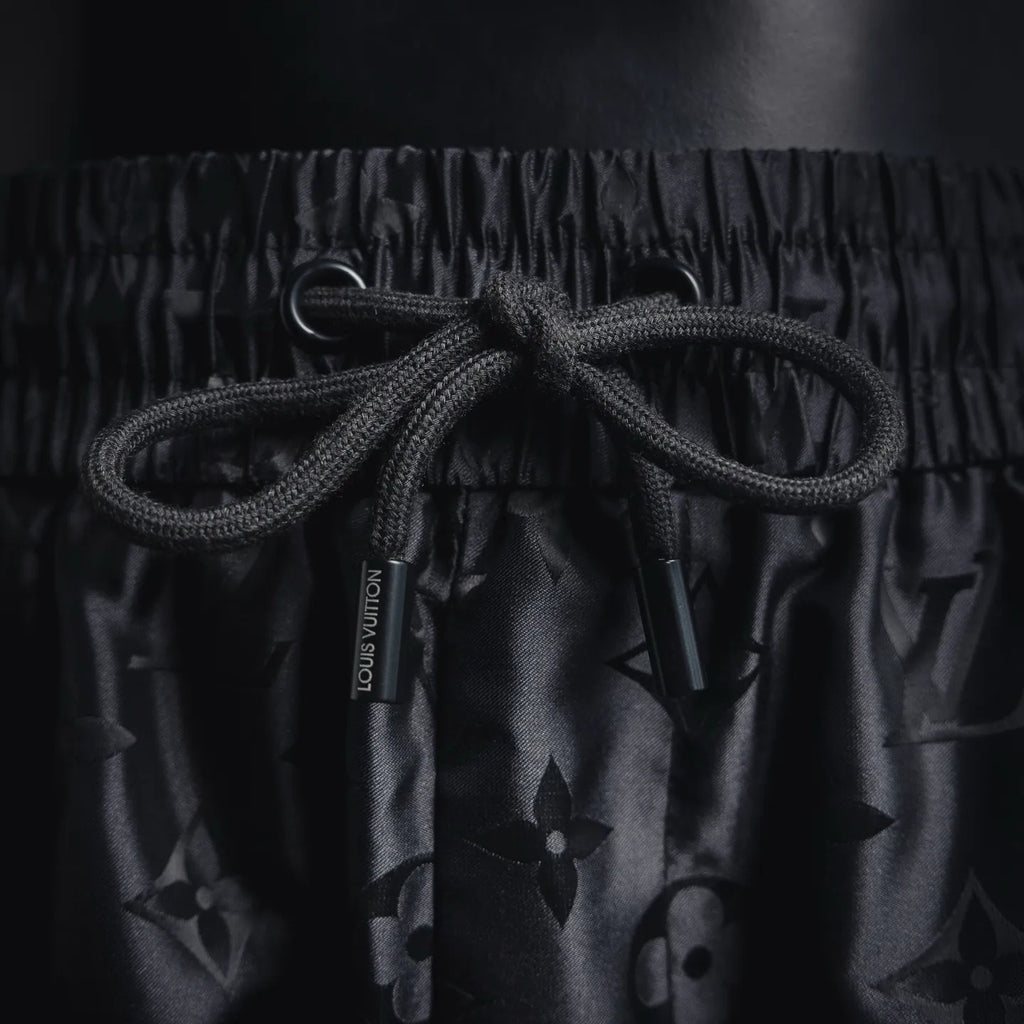 Louis Vuitton monogram shorts drawstring with black cord and dark patterned fabric