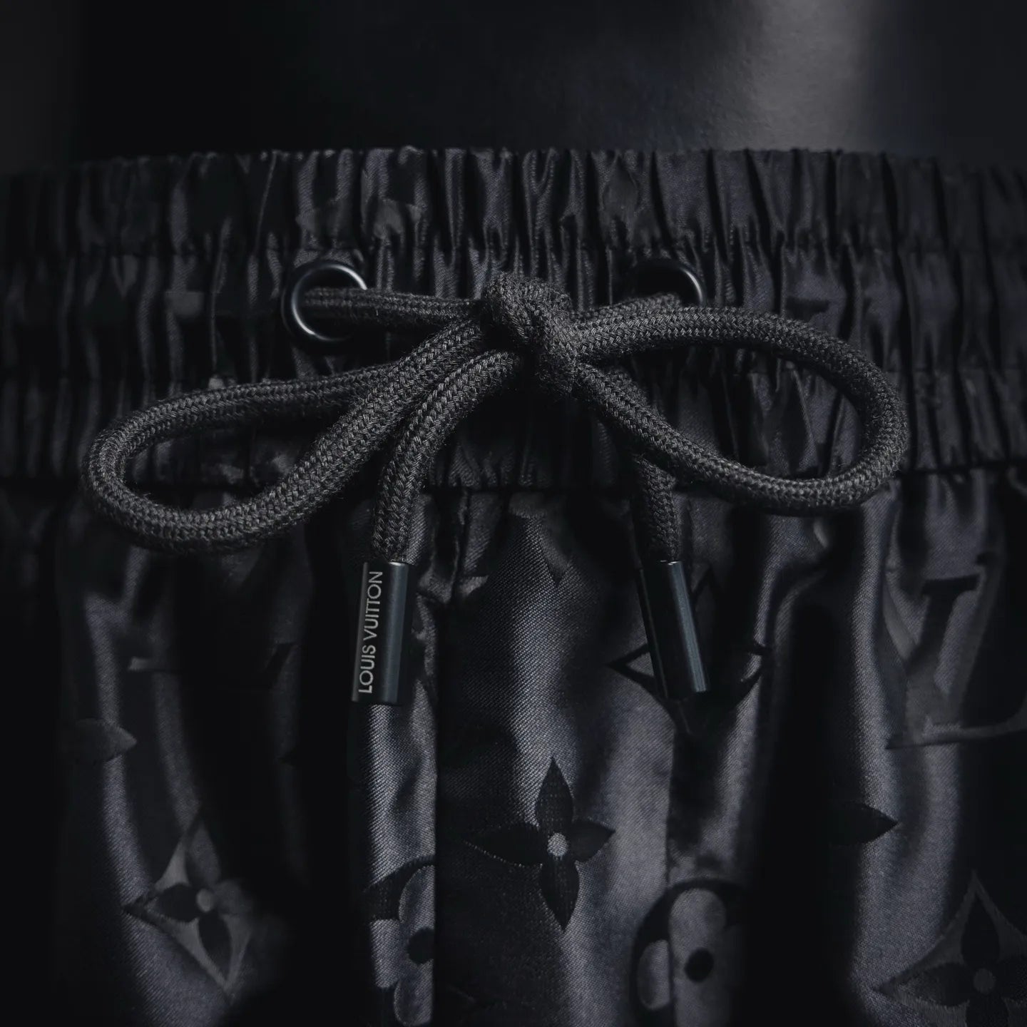 Louis Vuitton monogram shorts drawstring with black cord and dark patterned fabric