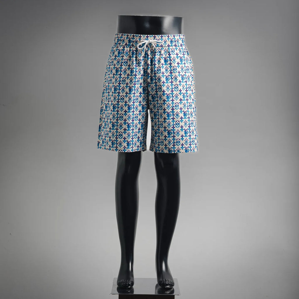 Blue and white patterned shorts with elastic waistband and drawstring