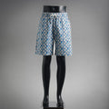 Blue and white patterned shorts with elastic waistband and drawstring
