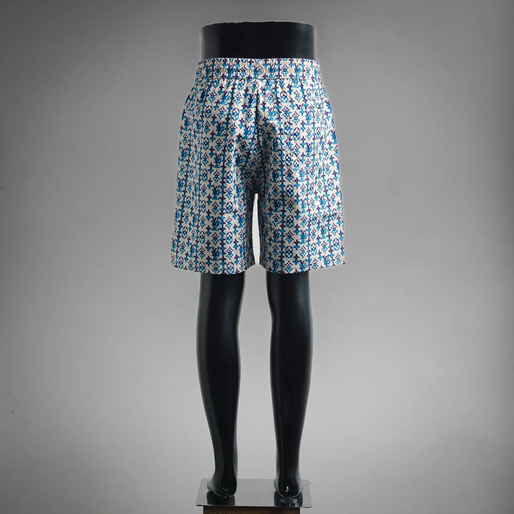Blue and white patterned shorts, mid-thigh length, elastic waist and drawstring