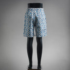 Blue and white patterned shorts, mid-thigh length, elastic waist and drawstring