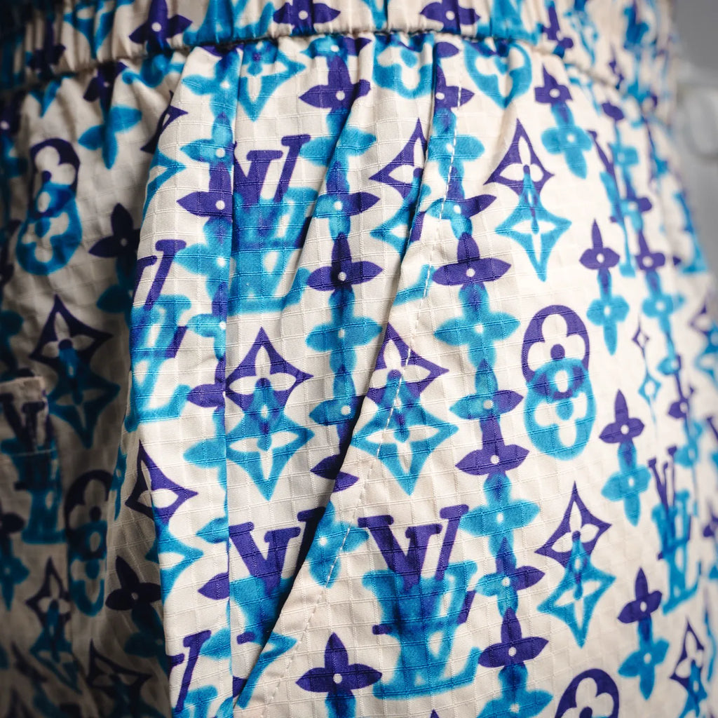 Blue and navy monogram shorts with relaxed fit and elastic waist