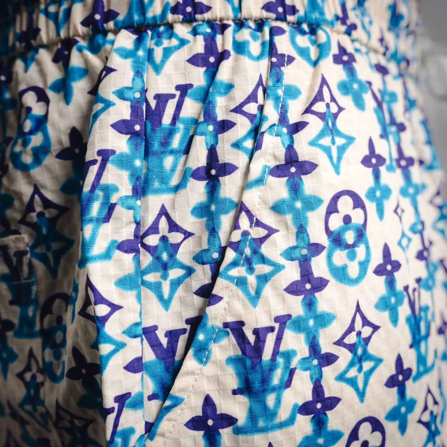 Blue and navy monogram shorts with relaxed fit and elastic waist