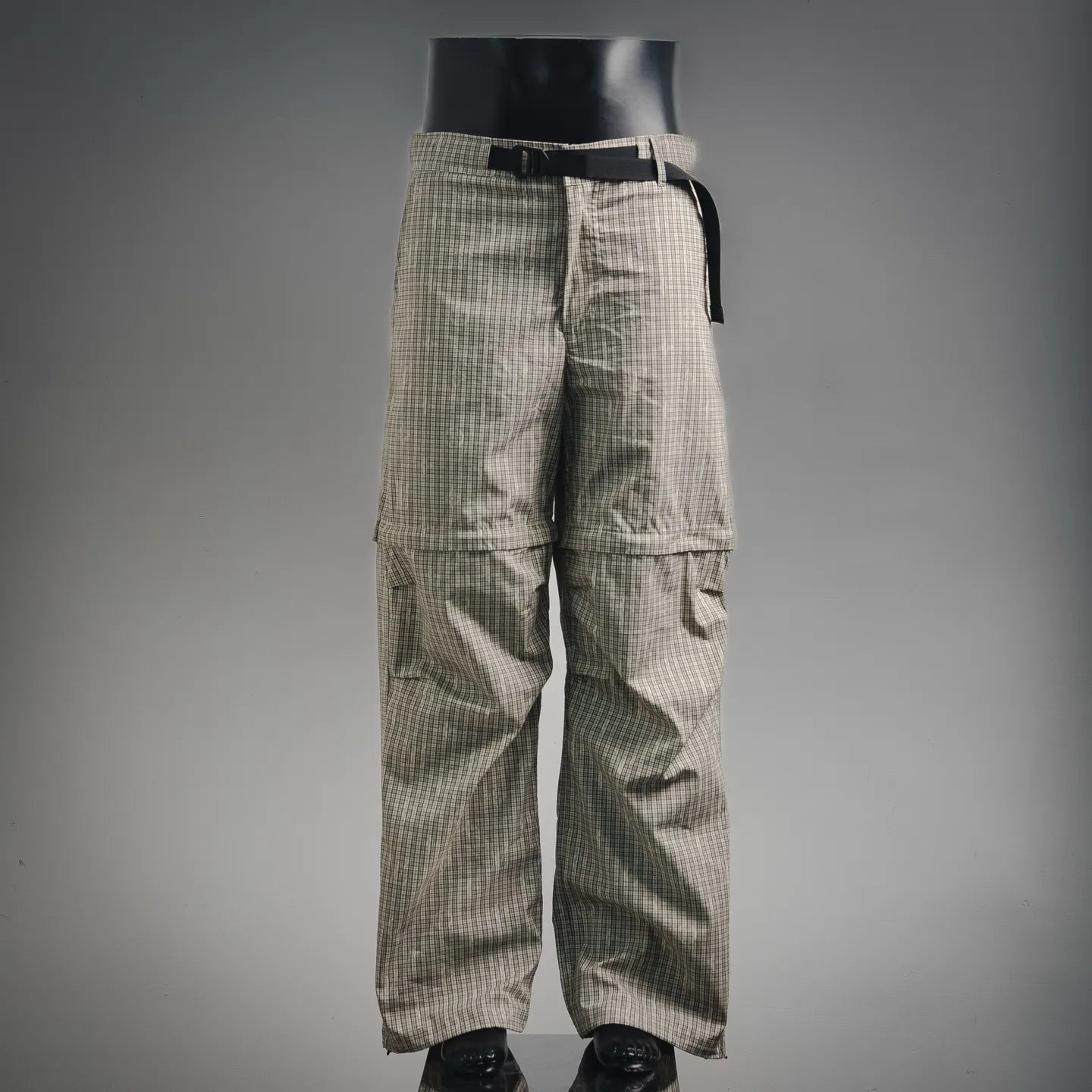 Plaid pants with cargo-style side pockets and drawstring waist