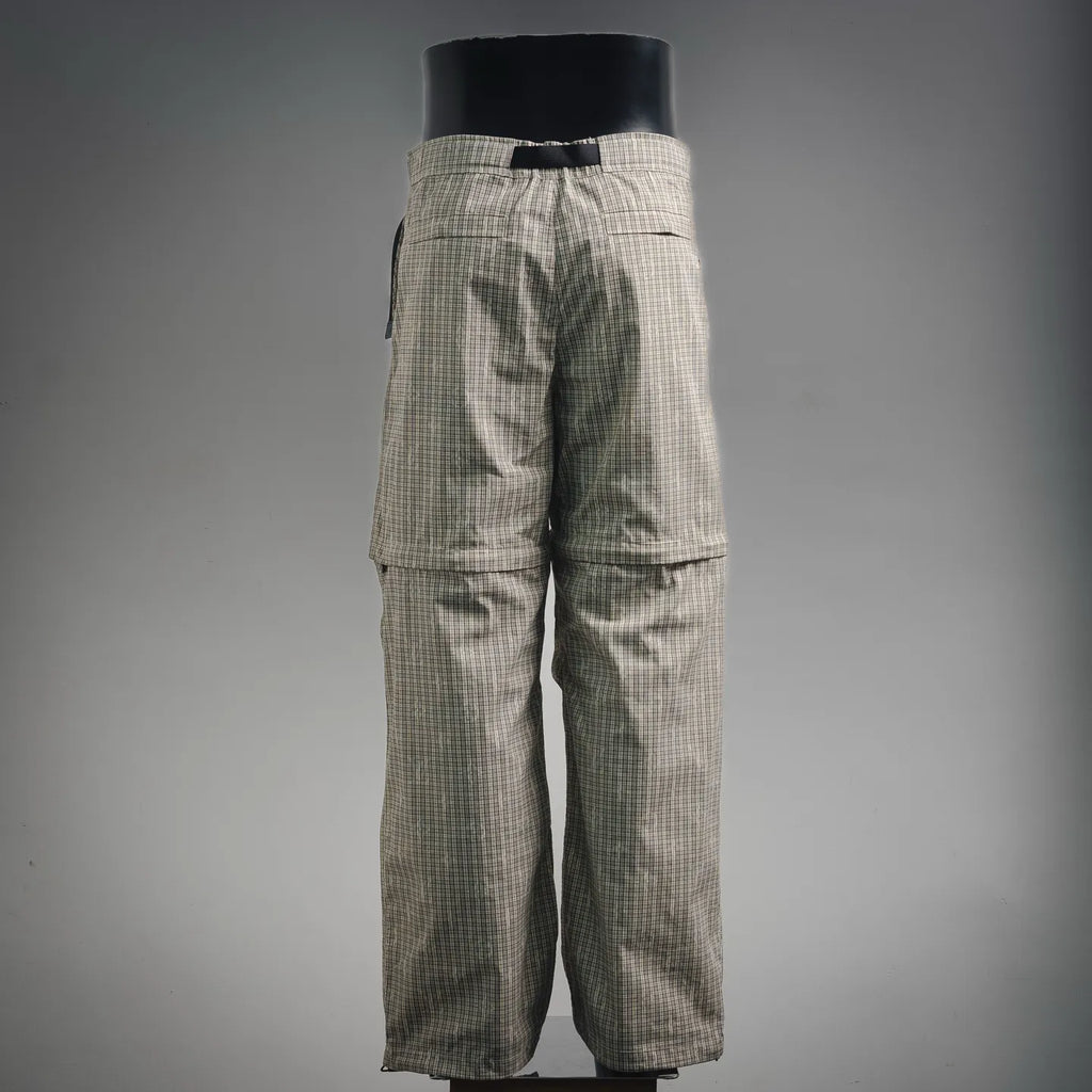 Plaid pants with cargo-style legs and buttoned flap pockets