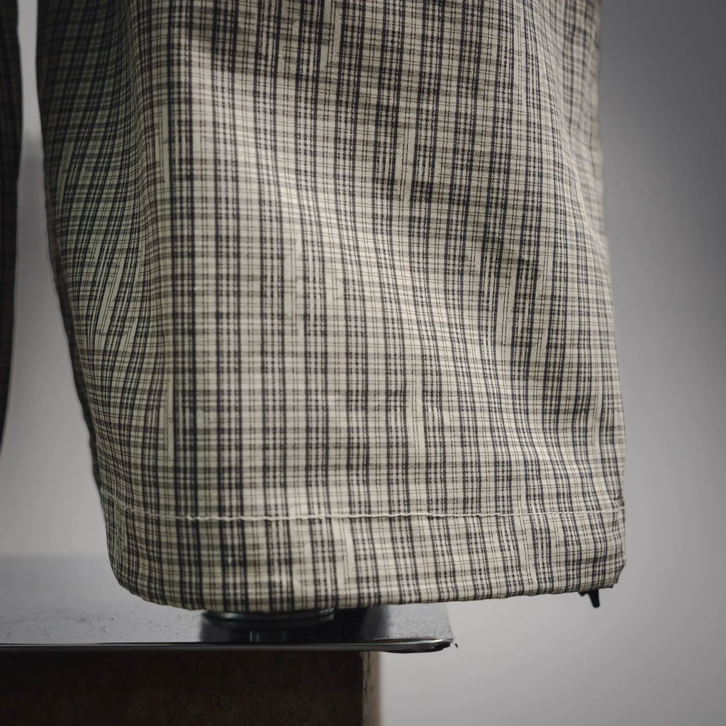 Plaid pants hem with cargo pocket panel and stitched cuff