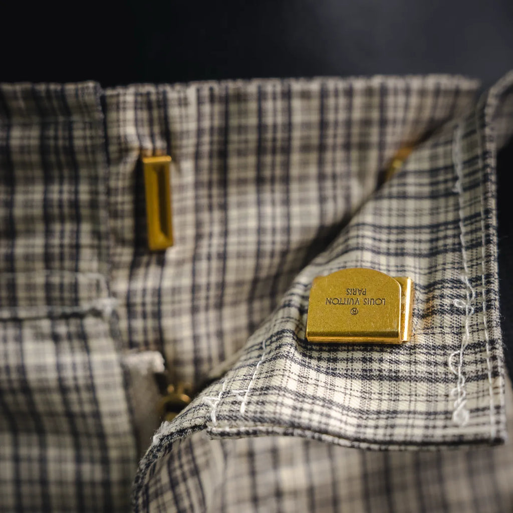 Plaid pants with branded metal hardware and small interior label