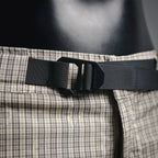 Waistband with black adjustable belt and plaid waistband panel