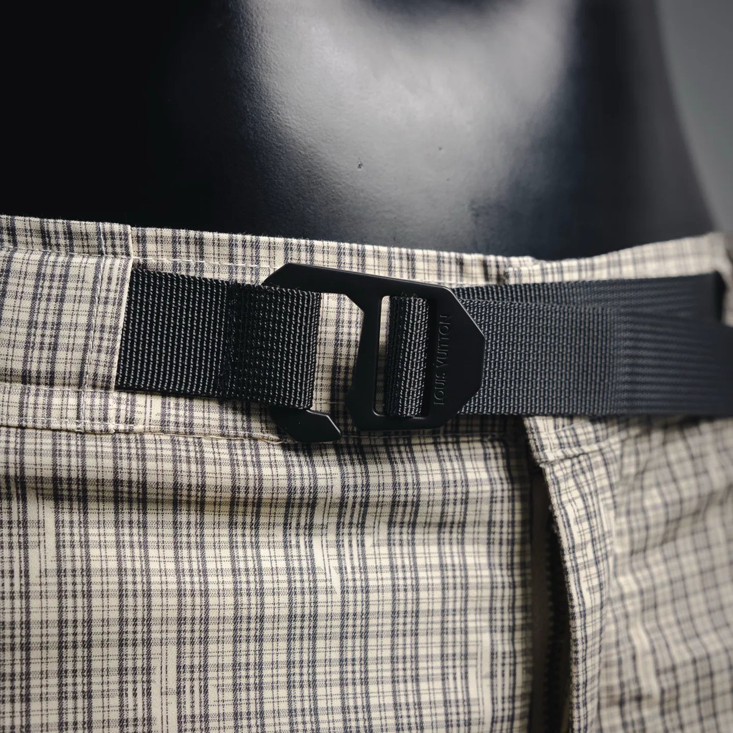 Waistband with black adjustable belt and plaid waistband panel