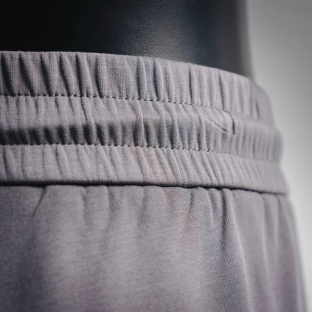Elastic waistband and stitched band of LV men's jogger pants, dark gray