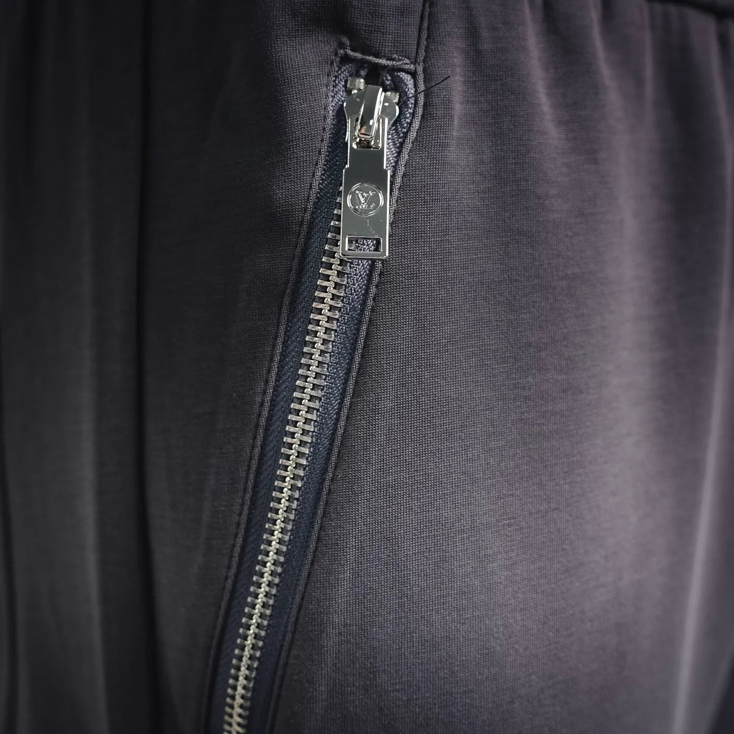 LV men's jogger pants zipper fly detail with metal zipper, dark gray