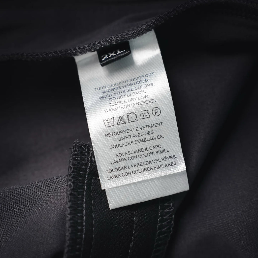 LV pants care and size label showing 2XL on inner seam, dark fabric