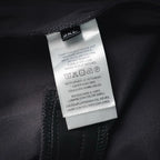 LV pants care and size label showing 2XL on inner seam, dark fabric
