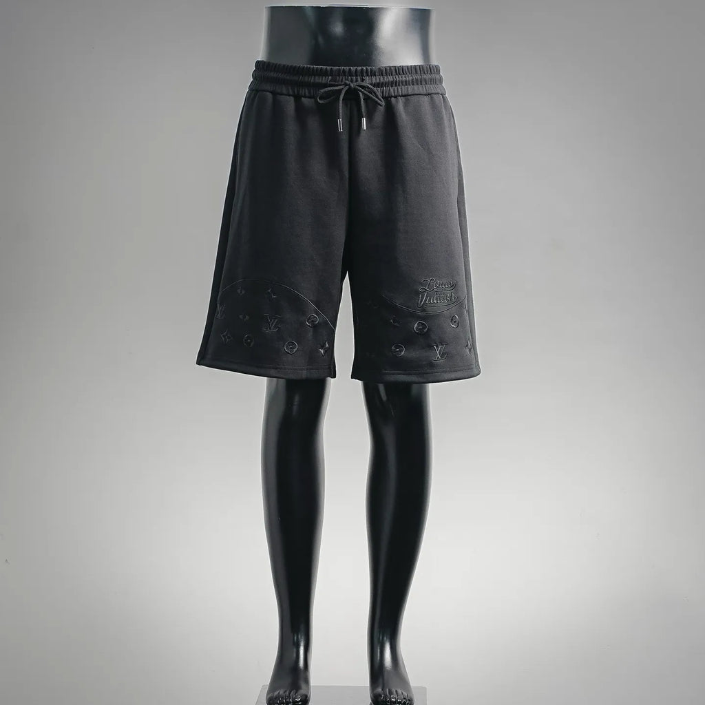 Black drawstring shorts with elastic waistband and LV-style logo embroidery