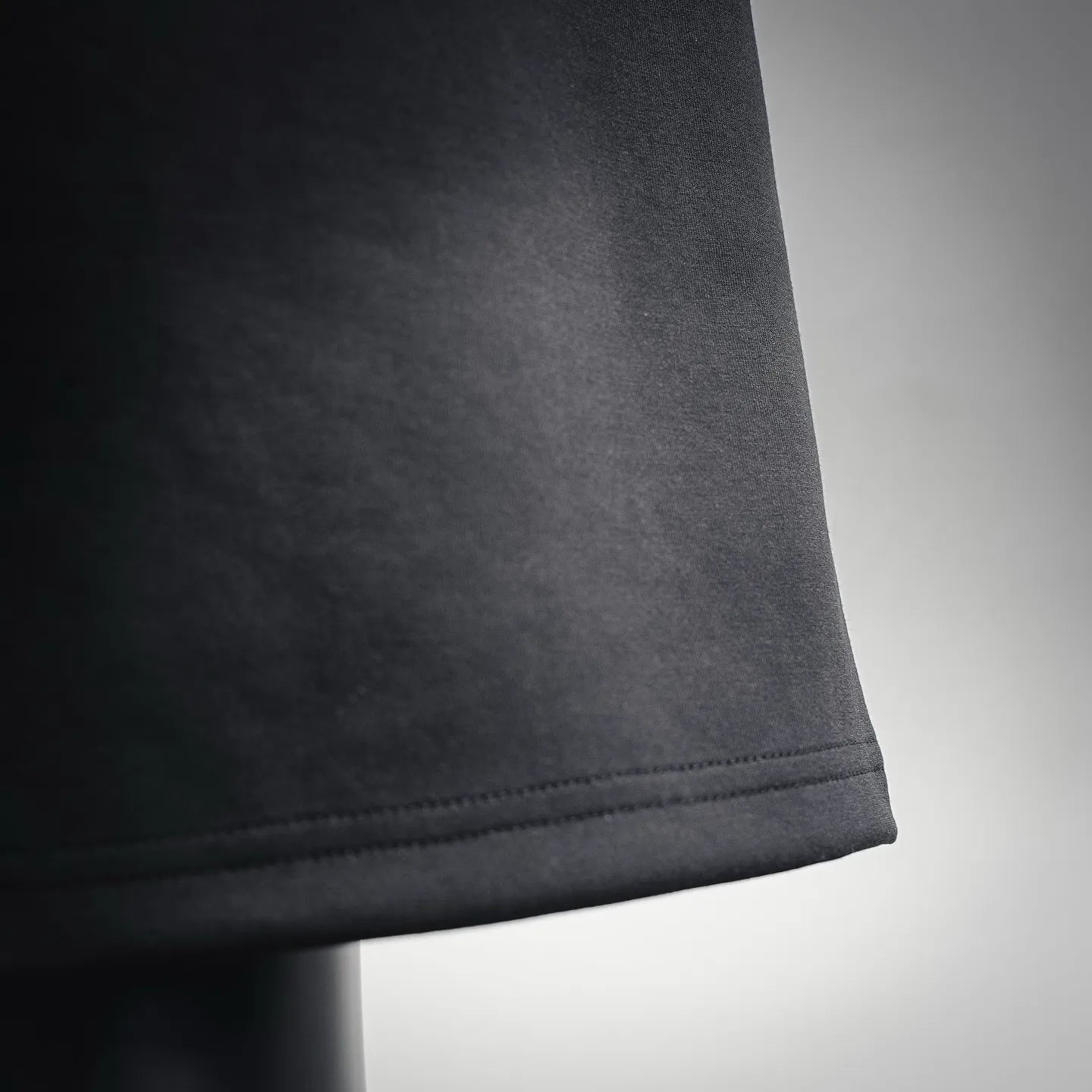 Black knit shorts hem with clean stitched cuff