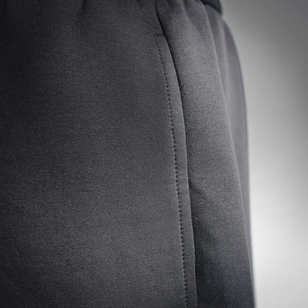 Black knit shorts with side seam and curved stitch line