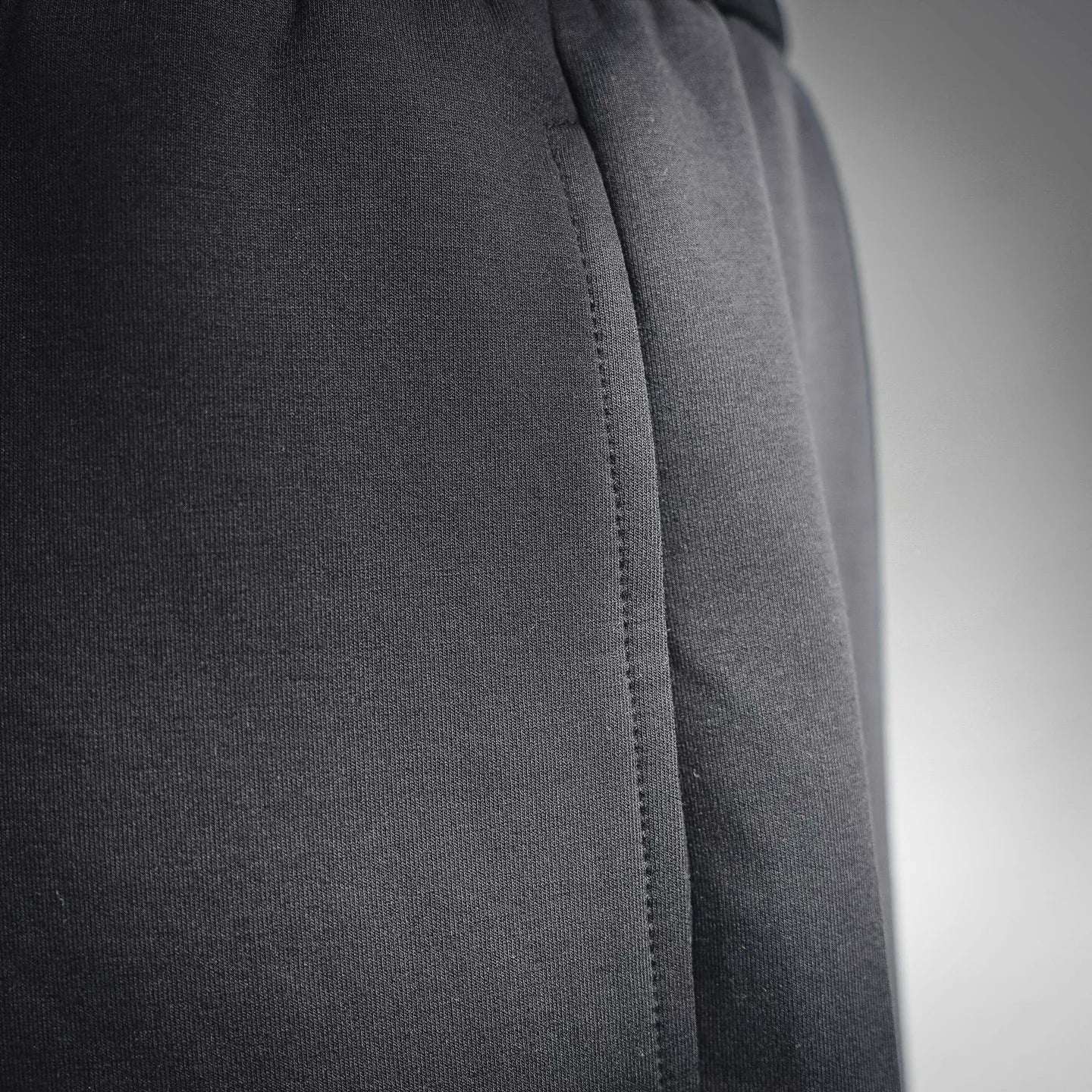Black knit shorts with side seam and curved stitch line
