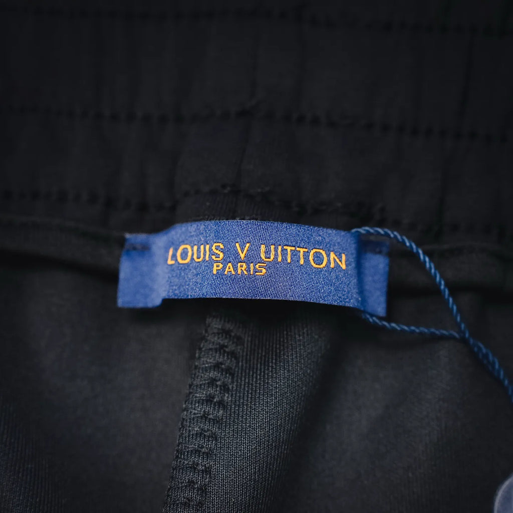 Black shorts inner tag reading 'LOUIS VUITTON PARIS'