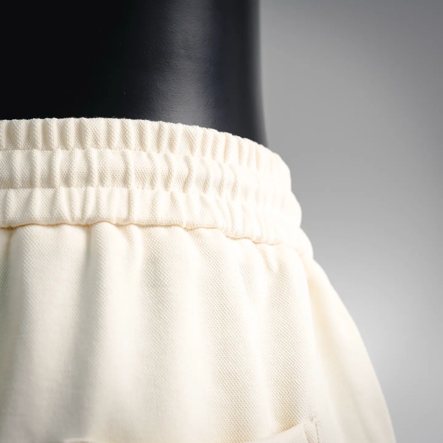 Cream elastic waistband with textured fabric detail