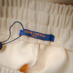 Cream drawstring shorts with Louis Vuitton Paris waistband label tag