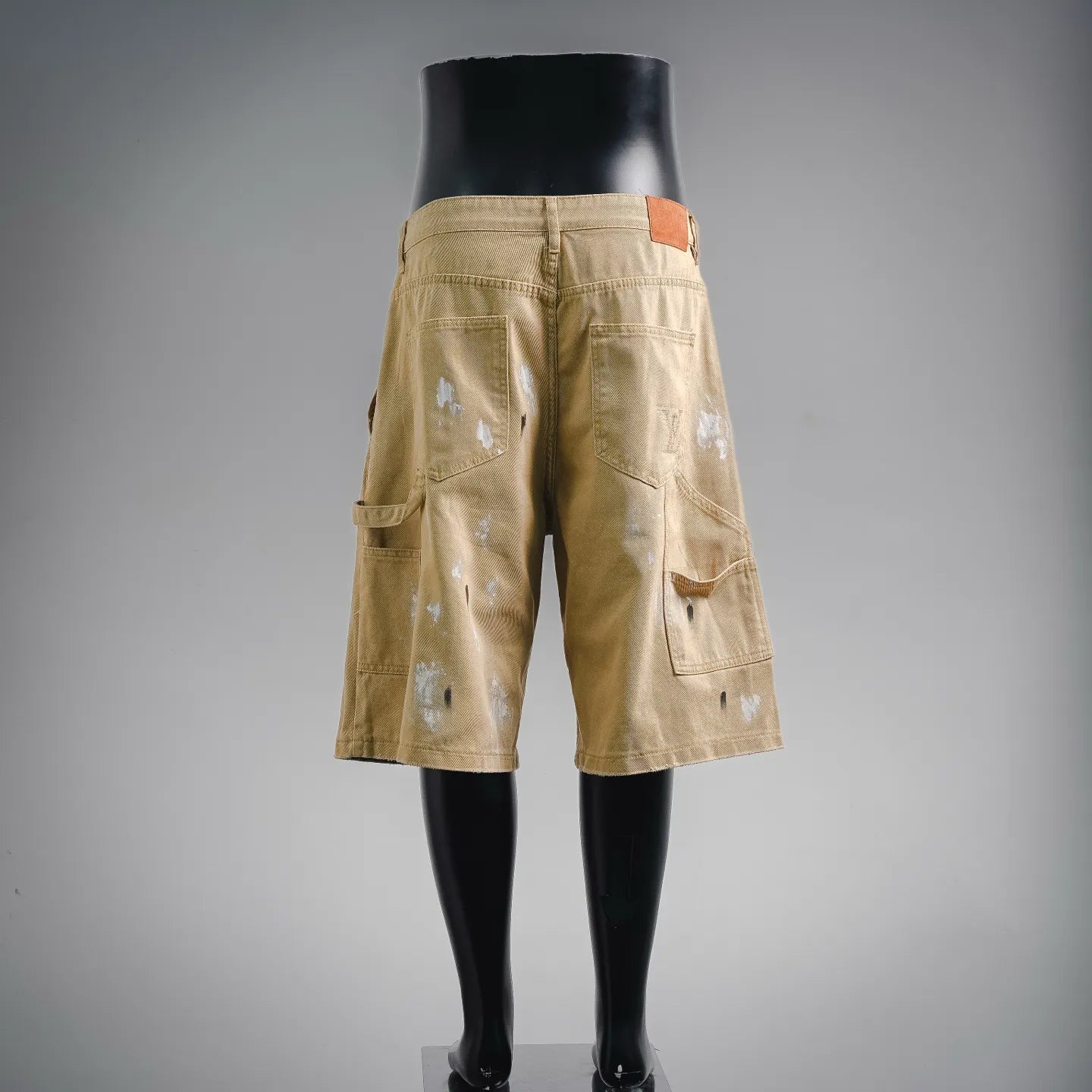 Beige LV utility shorts with back pockets and waistband tab