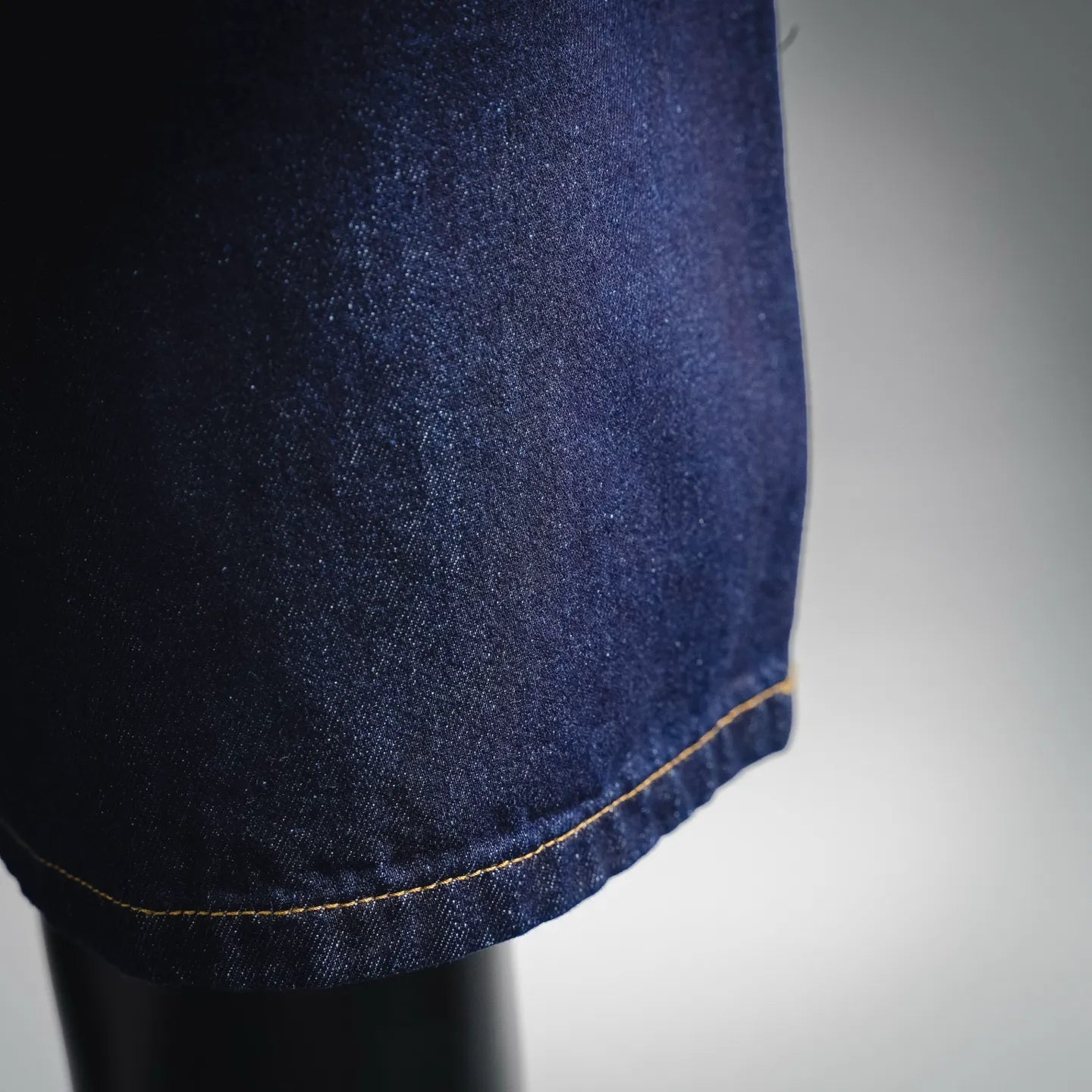 LV dark blue denim shorts hem with yellow contrast stitching