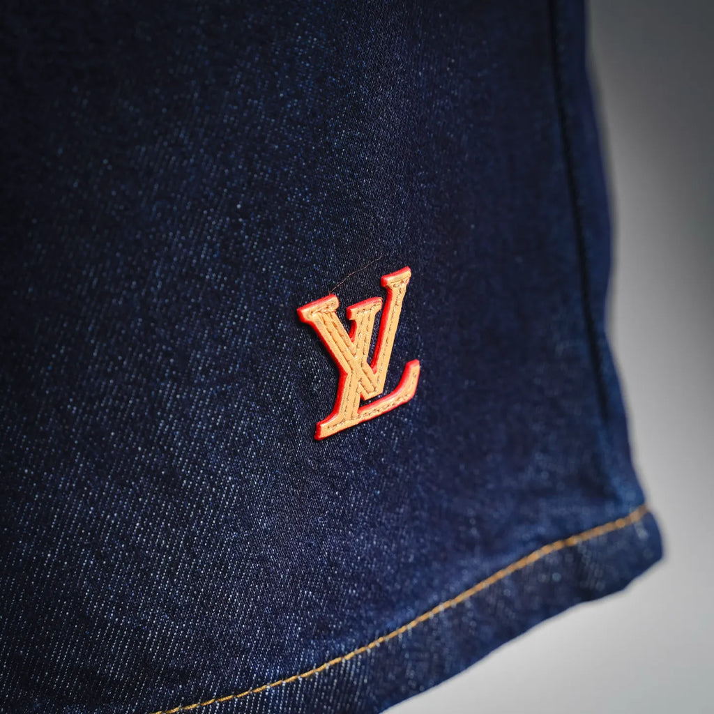LV dark blue denim shorts side with LV logo detail and yellow stitching