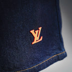 LV dark blue denim shorts side with LV logo detail and yellow stitching