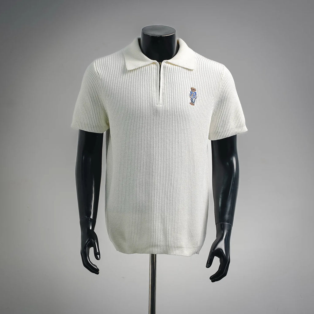 Off-white knit short-sleeve polo with buttonless half-zip and embroidered bear logo
