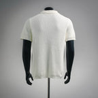 Off-white knit short-sleeve polo shirt, back view with ribbed texture