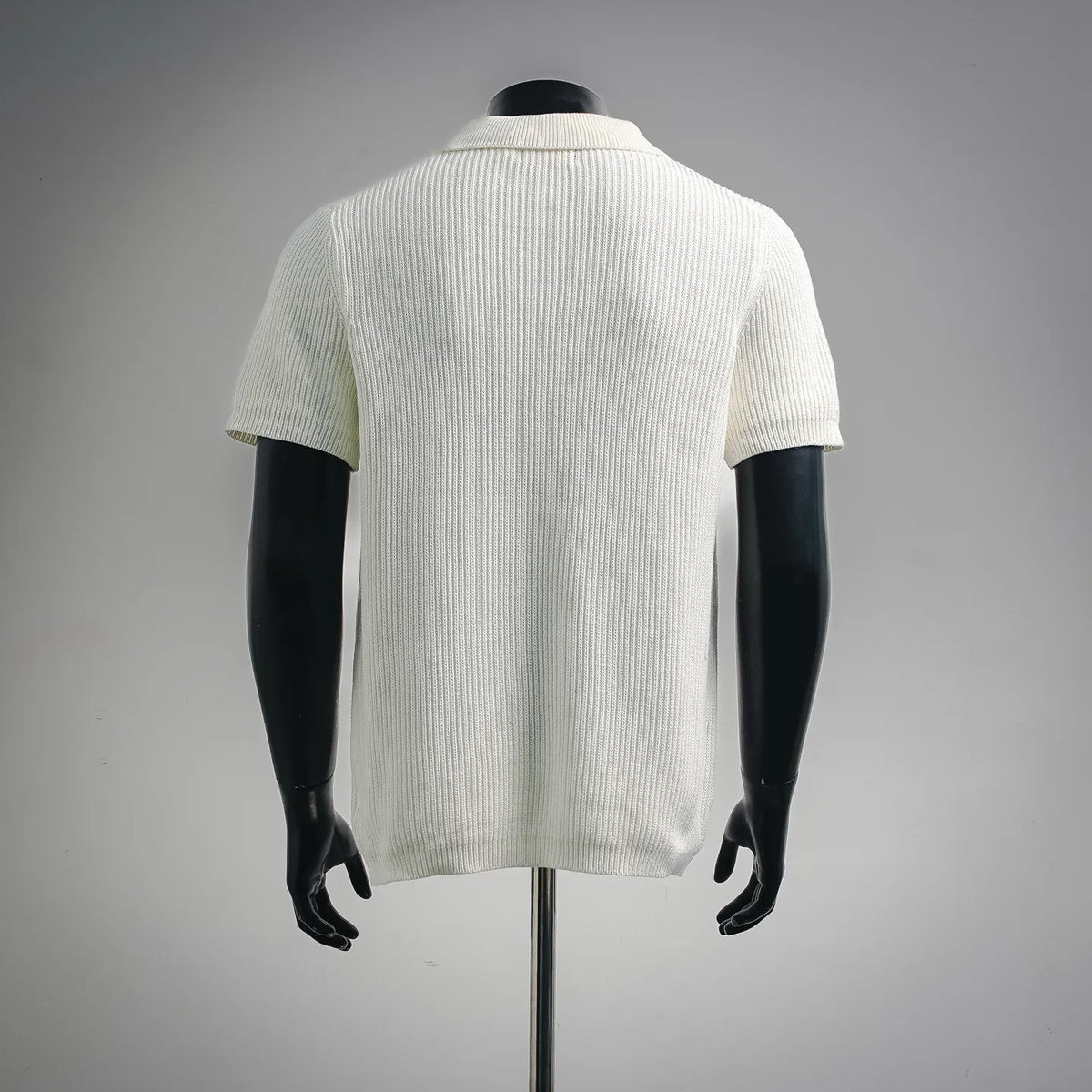 Off-white knit short-sleeve polo shirt, back view with ribbed texture