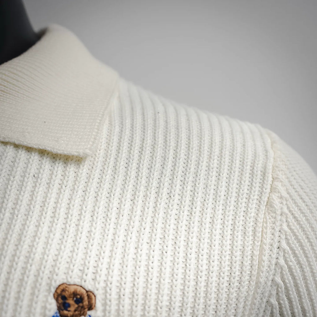 Off-white knit polo shoulder and collar seam with soft ribbing