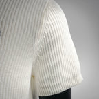 Off-white knit short-sleeve polo with ribbed sleeve cuff and side seam