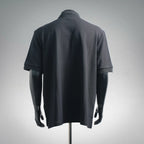 Dark navy polo shirt back view with short sleeves and ribbed collar