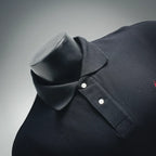 Dark navy polo shirt neckline close-up with button placket and chest pocket seam