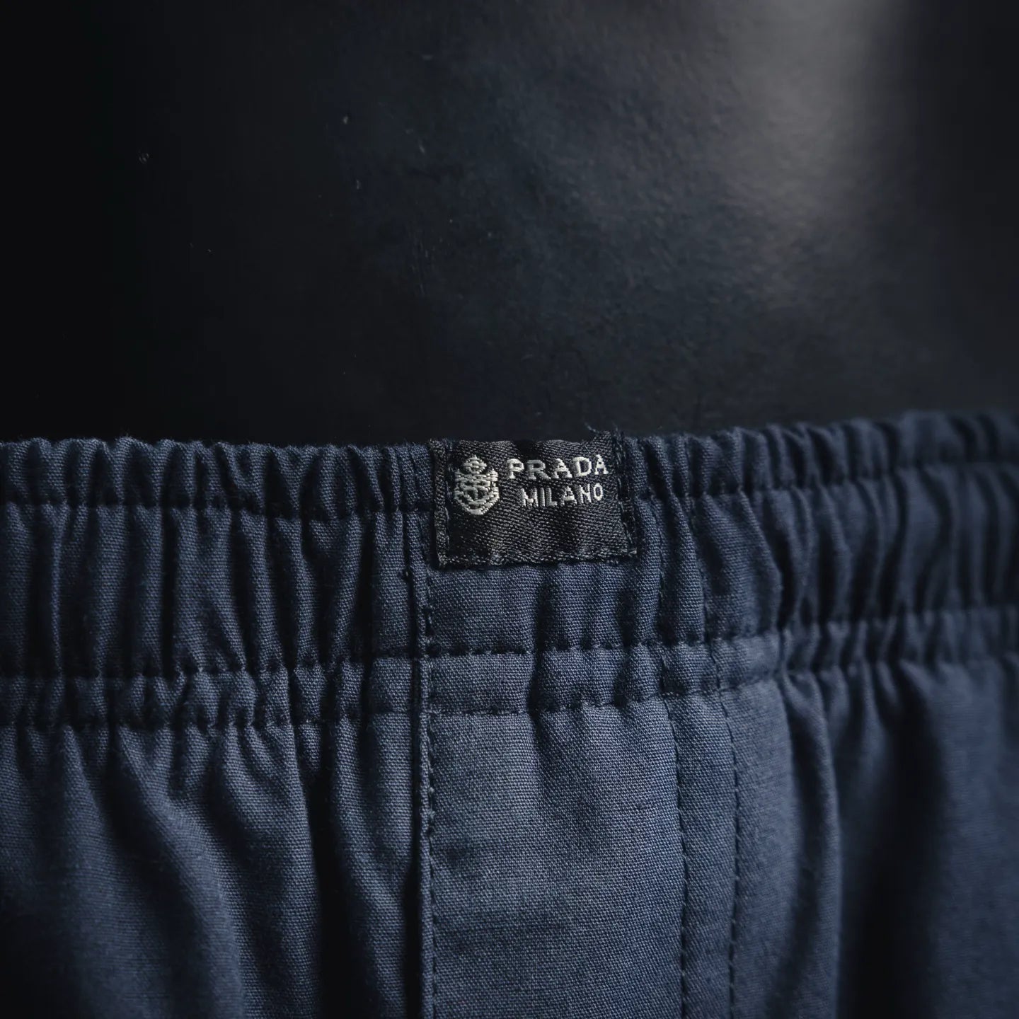 Prada Milano logo patch on navy elastic waistband