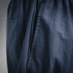 Navy Prada pants with side pleat and vertical seam detail