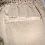 Beige pants front pocket with rectangular welt and top stitching