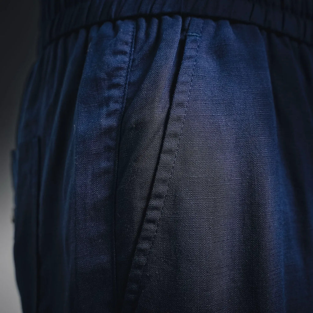 Prada pants waist and pleat detail, dark blue woven fabric with seam lines