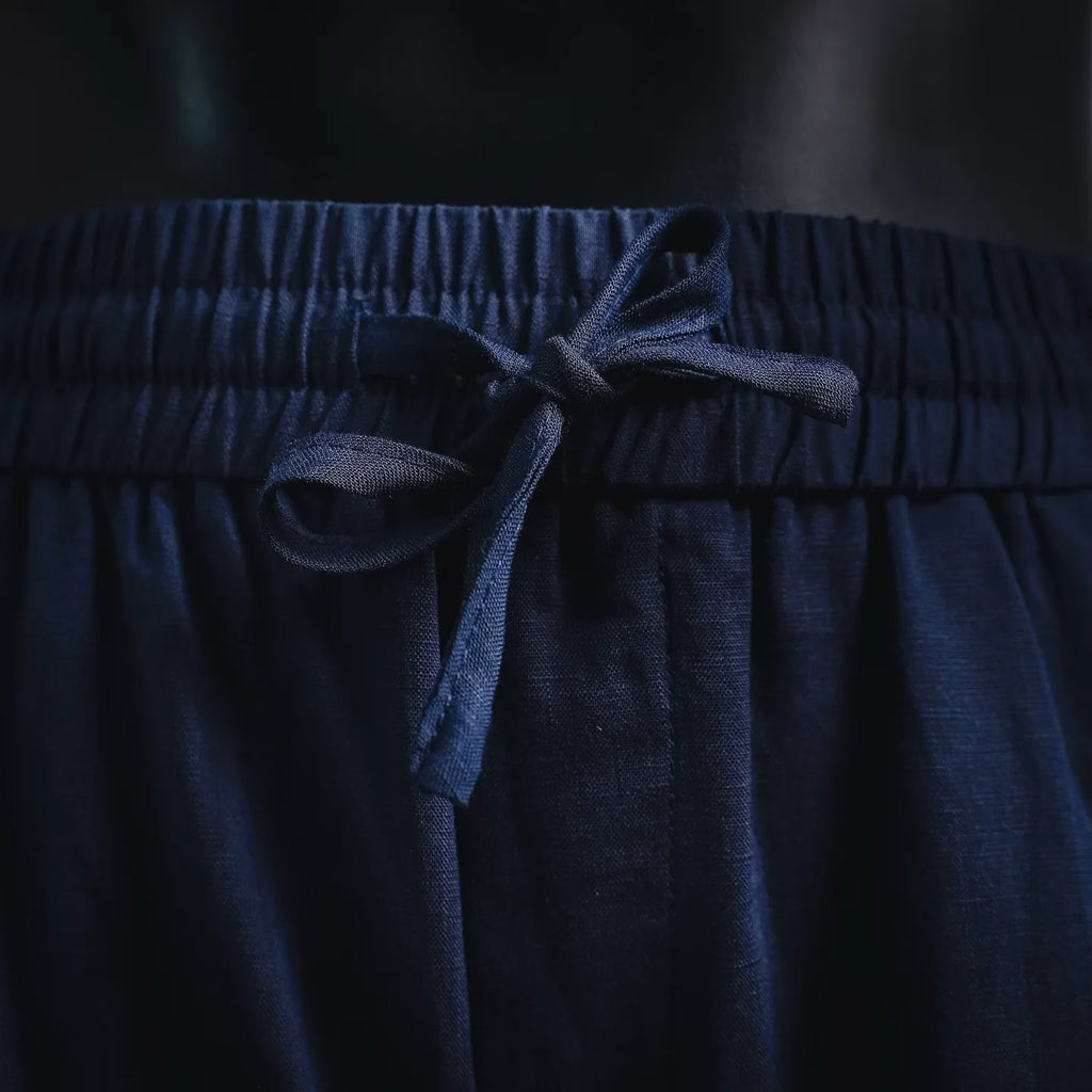 Prada pants elastic waistband with dark blue drawstring tied at center