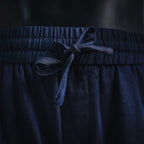 Prada pants elastic waistband with dark blue drawstring tied at center